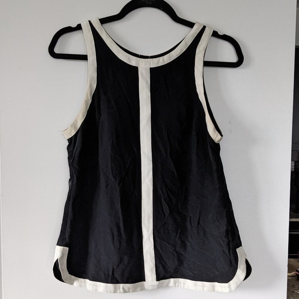 Black sleeveless silk top with split back